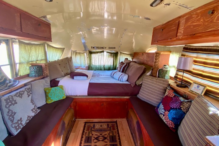 a living room filled with furniture and a large window