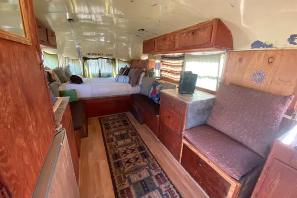 a room filled with furniture and a large window