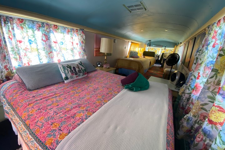 a bedroom with a bed in a room