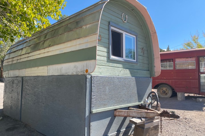 a house that is parked on the side of a building
