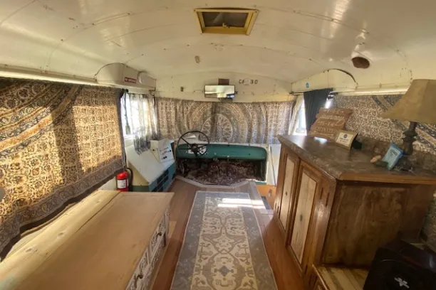 a room filled with furniture and a stove