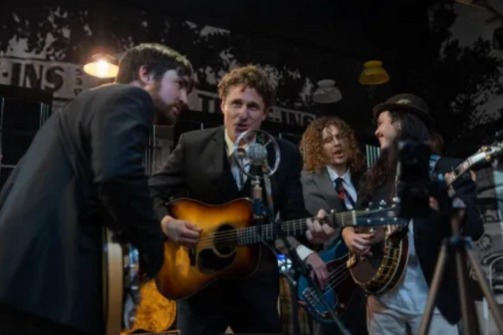 a man holding a guitar